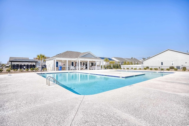 view of swimming pool featuring a patio area