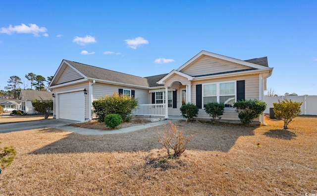 ranch-style house featuring a garage and a porch