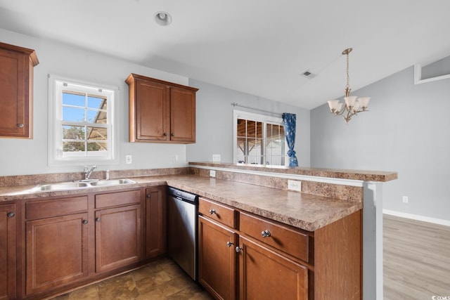 kitchen with decorative light fixtures, sink, stainless steel dishwasher, a notable chandelier, and kitchen peninsula