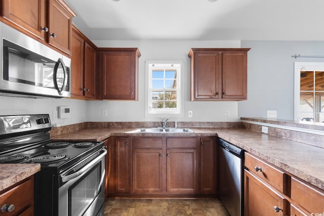 kitchen featuring appliances with stainless steel finishes and sink