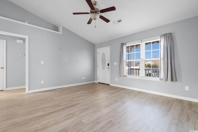 interior space featuring ceiling fan, vaulted ceiling, and light wood-type flooring