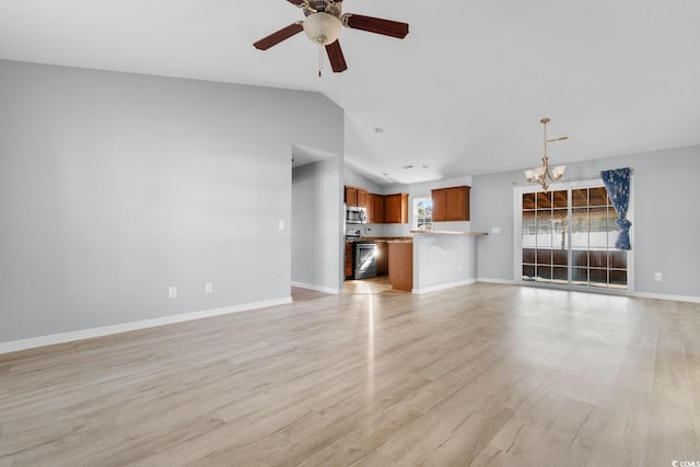 unfurnished living room featuring lofted ceiling, ceiling fan with notable chandelier, and light wood-type flooring