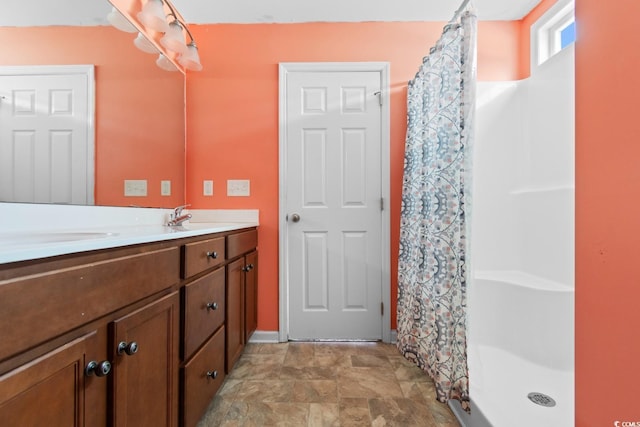 bathroom featuring a shower with curtain and vanity