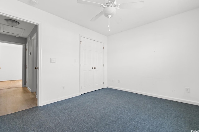 unfurnished bedroom featuring ceiling fan and carpet