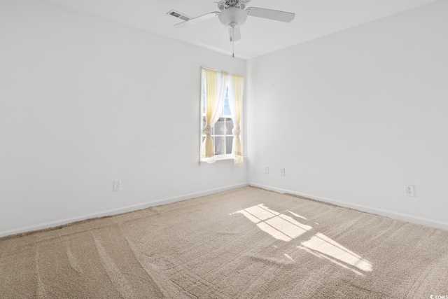 empty room featuring carpet and ceiling fan