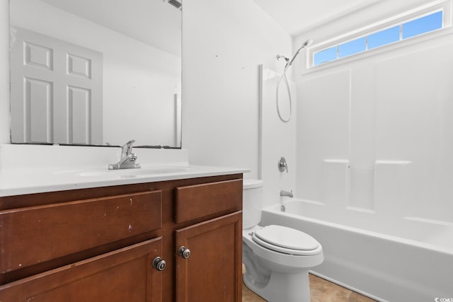 full bathroom featuring washtub / shower combination, vanity, and toilet