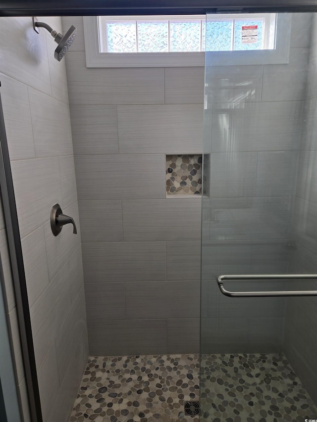 bathroom featuring a shower stall