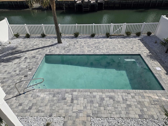 328 46th Ave N, North Myrtle Beach, SC 29582 - view of swimming pool featuring a water view, a fenced backyard, and a patio