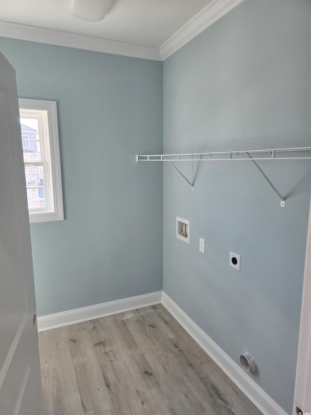 laundry area featuring laundry area, baseboards, light wood-type flooring, washer hookup, and electric dryer hookup