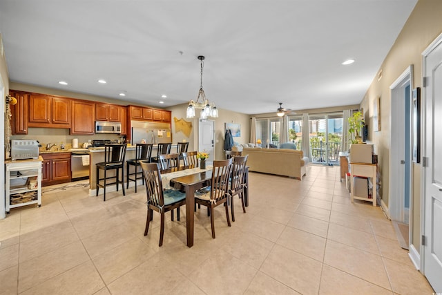 dining room featuring light tile patterned floors and recessed lighting