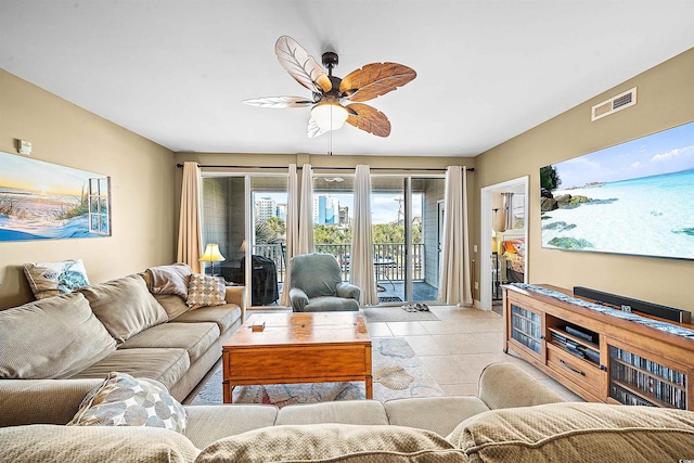 living room with light tile patterned floors, visible vents, and a ceiling fan