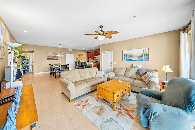 living room with light tile patterned floors, ceiling fan, baseboards, and recessed lighting