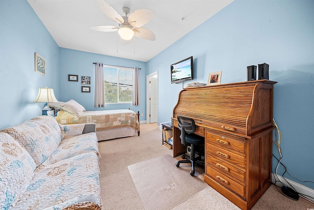 office space with ceiling fan, baseboards, and light colored carpet