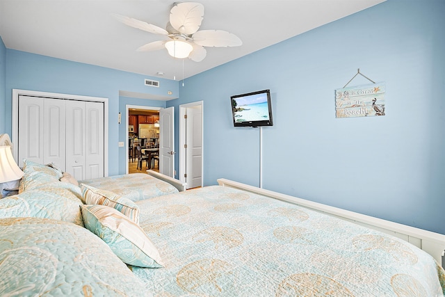 bedroom featuring a ceiling fan, a closet, and visible vents