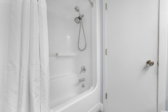 full bathroom featuring shower / bathtub combination with curtain