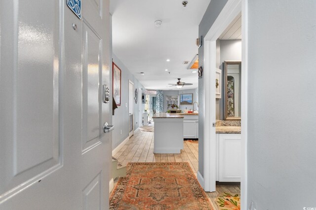 hallway featuring sink