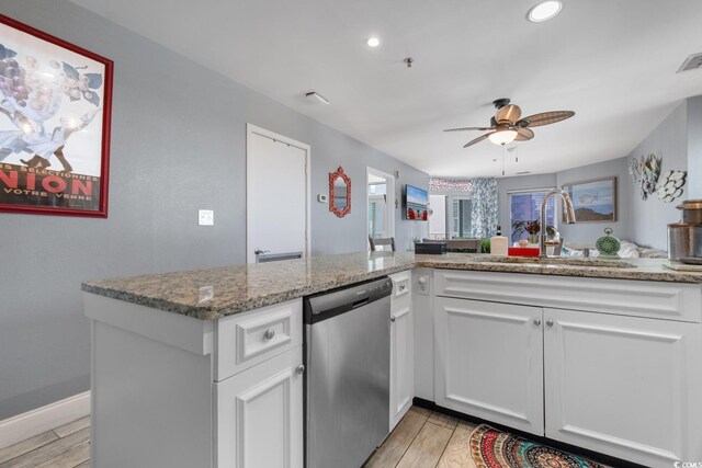 kitchen with ceiling fan, dishwasher, sink, and white cabinets