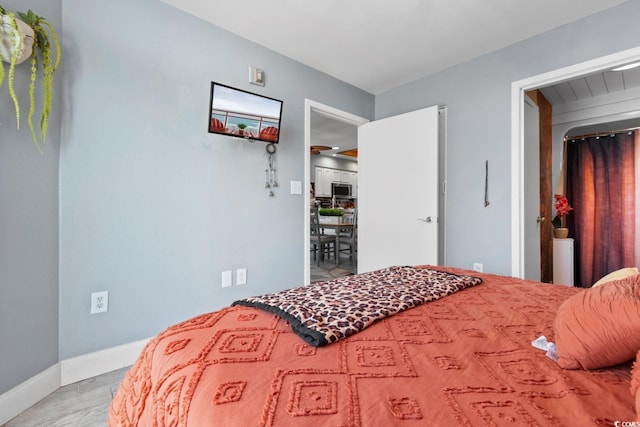 bedroom featuring baseboards