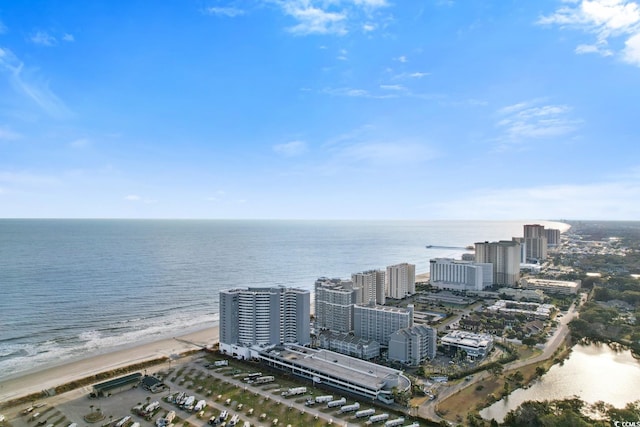 birds eye view of property with a water view and a view of city