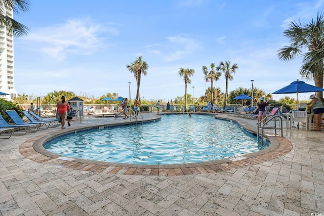 community pool with a patio