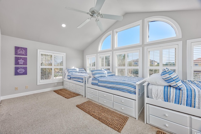 carpeted bedroom with high vaulted ceiling and ceiling fan