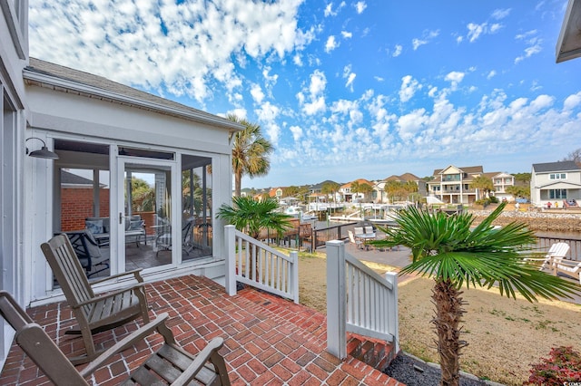 view of patio / terrace with a sunroom