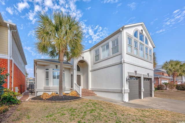 view of front facade featuring a garage and a front lawn