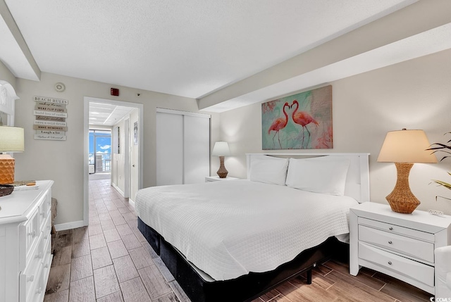 bedroom with a closet and a textured ceiling