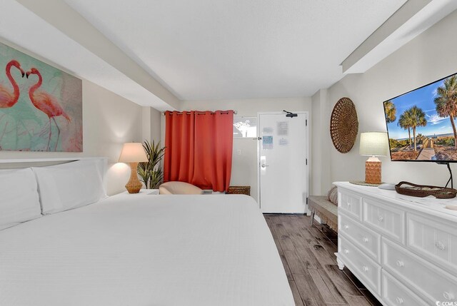 bedroom featuring hardwood / wood-style floors