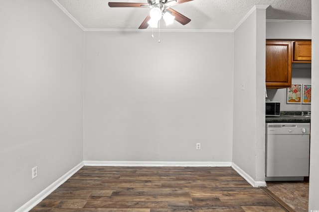 kitchen featuring dark hardwood / wood-style floors, dishwasher, and a textured ceiling