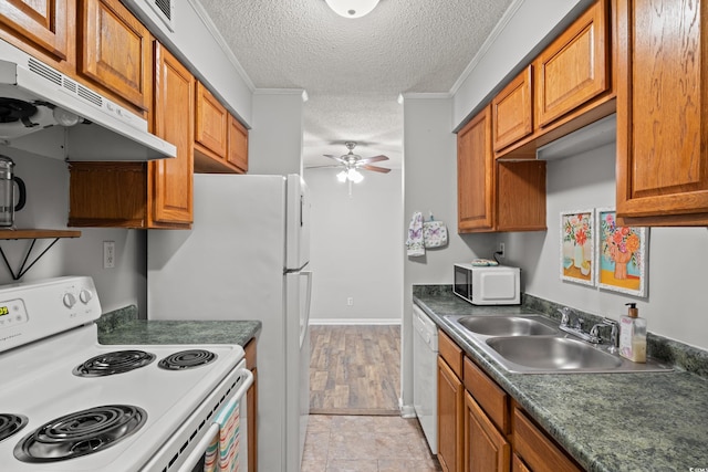 kitchen featuring sink, white appliances, ceiling fan, crown molding, and a textured ceiling