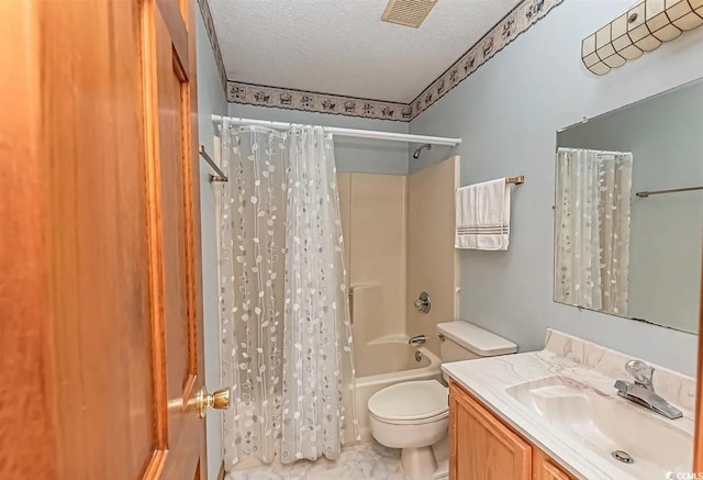 full bathroom with shower / bath combination with curtain, vanity, toilet, and a textured ceiling