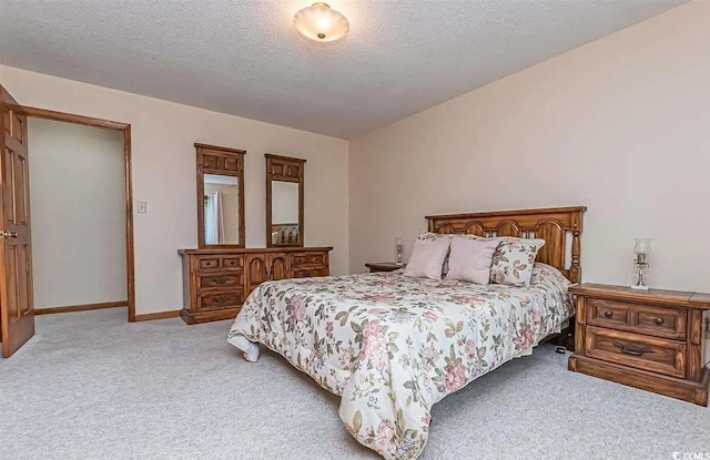 carpeted bedroom with a textured ceiling