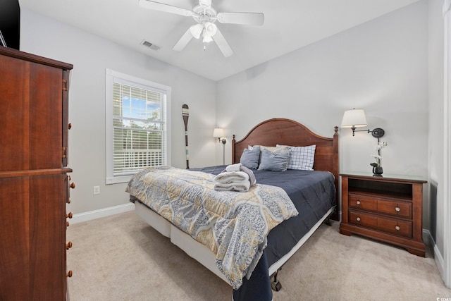 bedroom with light carpet and ceiling fan