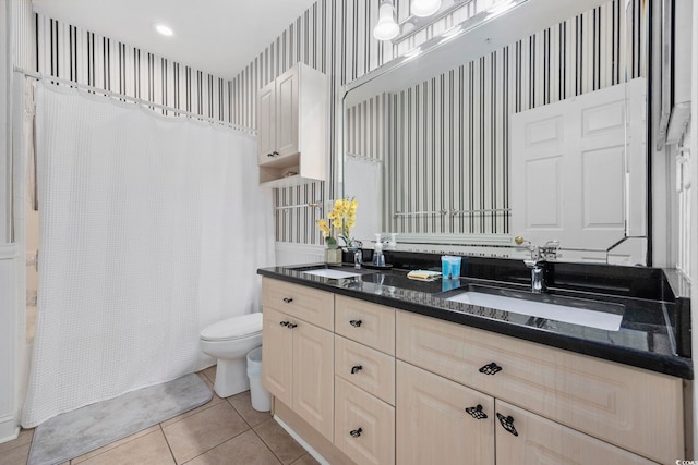 full bathroom featuring vanity, tile patterned floors, shower / bath combination with curtain, and toilet