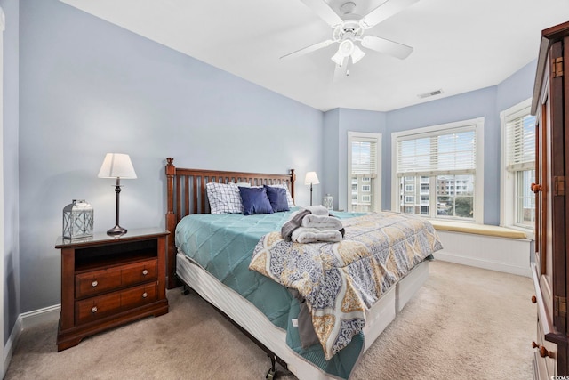 carpeted bedroom featuring ceiling fan