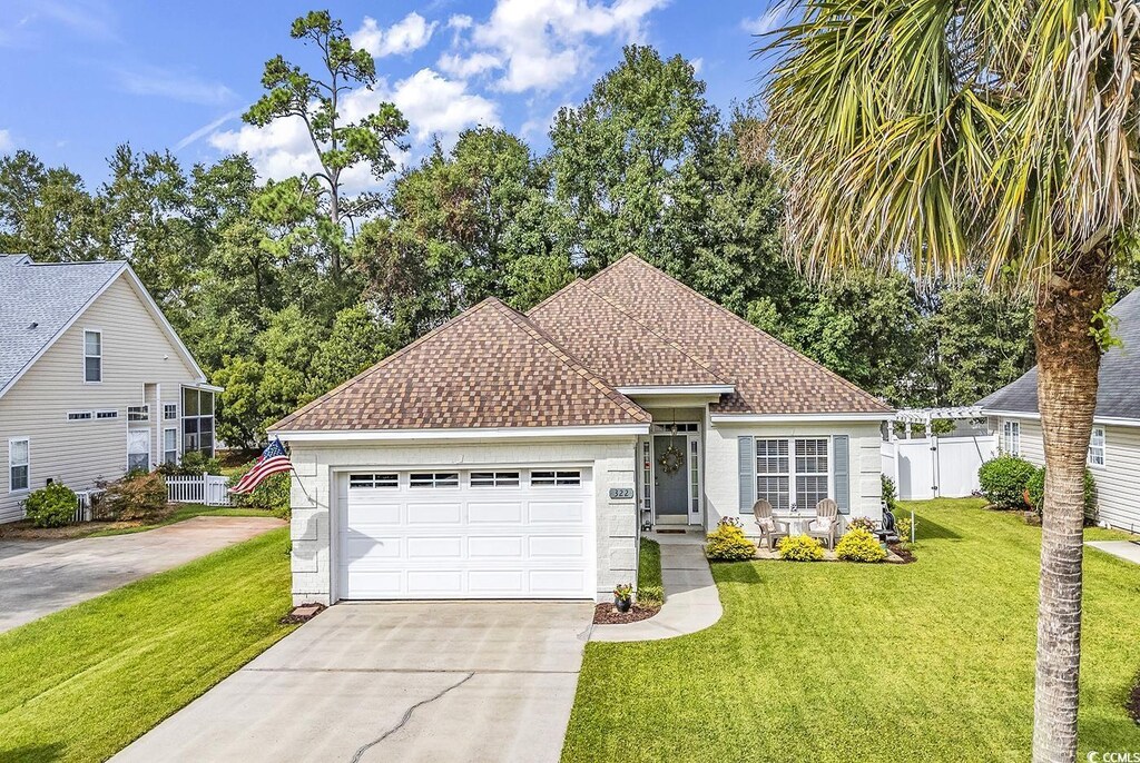 322 Crooked Oak Dr, Pawleys Island, SC 29585 - view of front of home with a garage and a front lawn