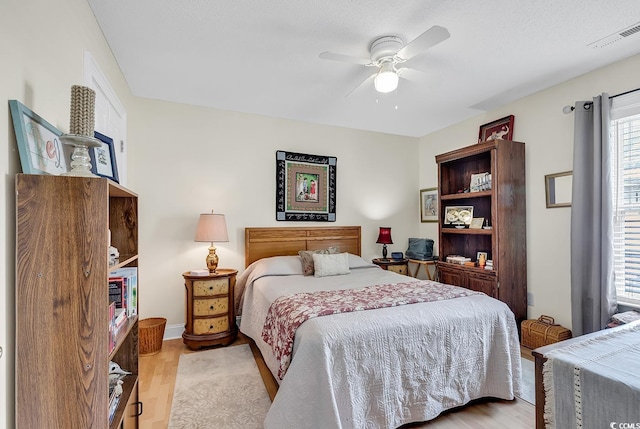 bedroom featuring ceiling fan and light wood-type flooring