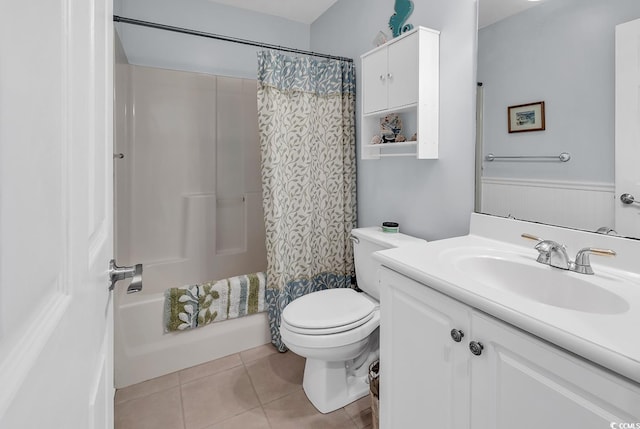 full bathroom with tile patterned flooring, vanity, toilet, and shower / bath combo with shower curtain