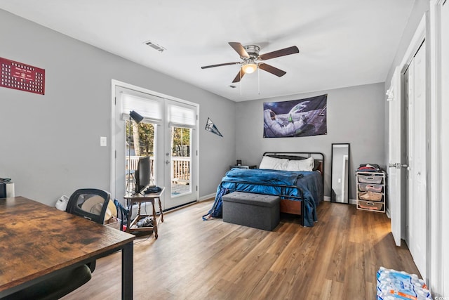 bedroom featuring ceiling fan, access to outside, french doors, and wood-type flooring