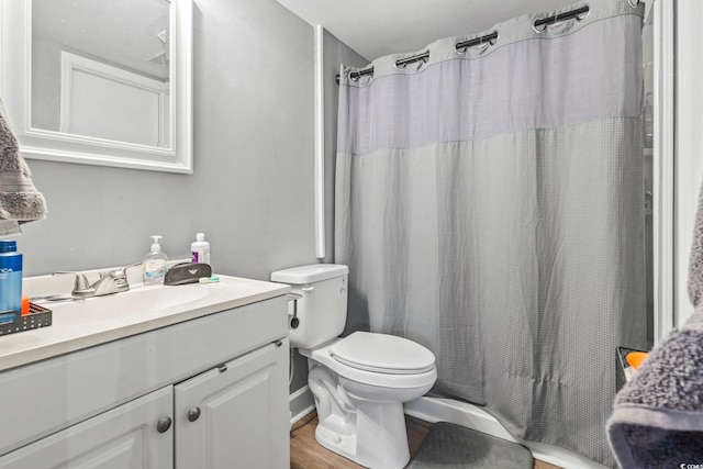 bathroom featuring a shower with curtain, vanity, toilet, and wood-type flooring