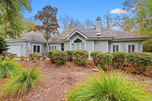 ranch-style home featuring a garage