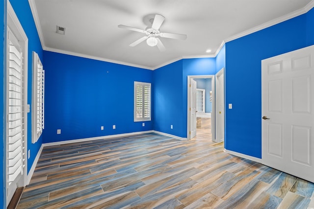 unfurnished bedroom featuring ceiling fan, ornamental molding, and wood-type flooring