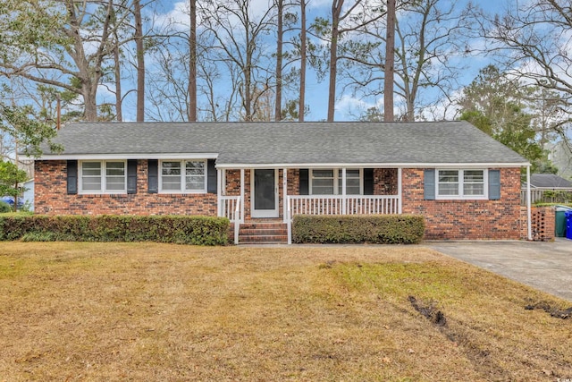 single story home with a porch and a front lawn