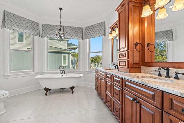 3567 Marion Ln, Murrells Inlet, SC 29576 - full bathroom with healthy amount of natural light, ornamental molding, double vanity, a freestanding tub, and baseboards