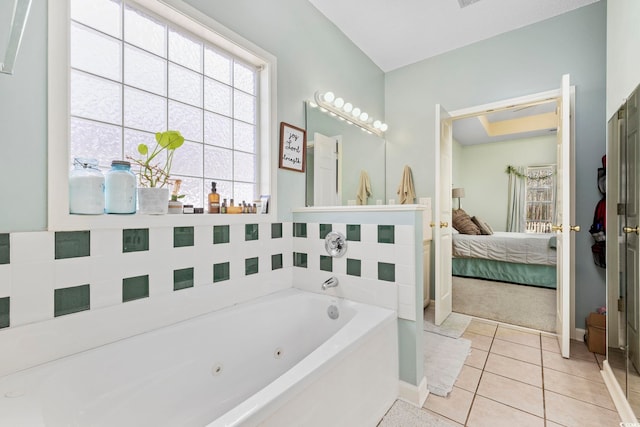 bathroom featuring tile patterned flooring and a tub