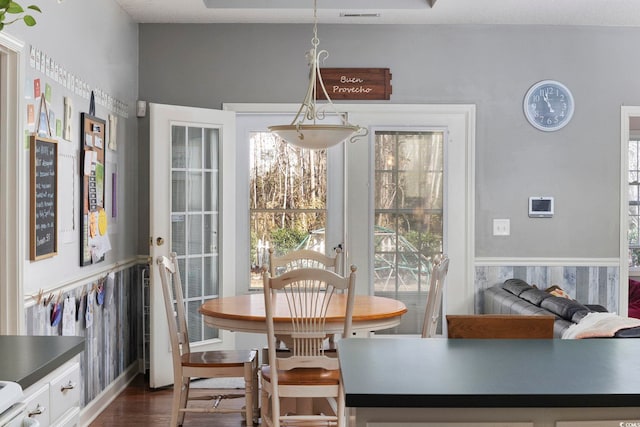 dining room with dark hardwood / wood-style floors