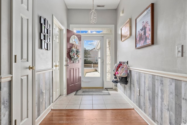 doorway to outside featuring light tile patterned floors