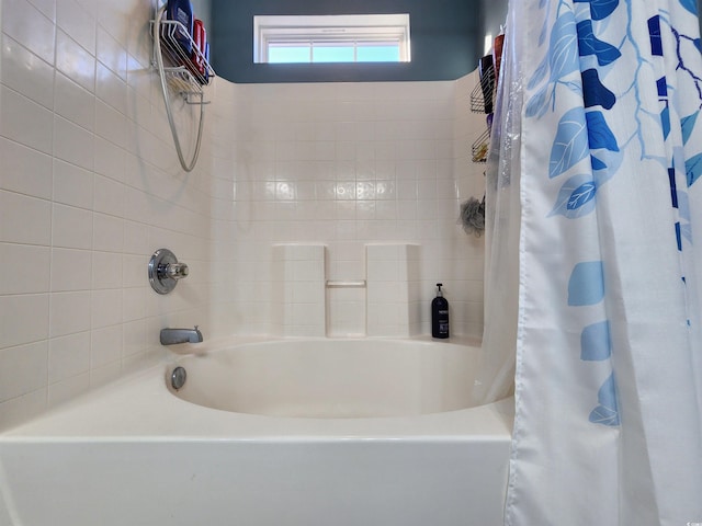 bathroom featuring shower / tub combo with curtain