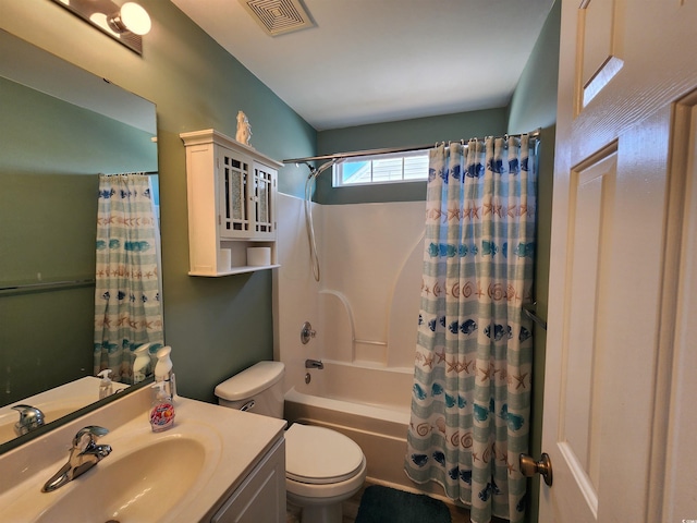 full bathroom with toilet, vanity, and shower / bath combo with shower curtain